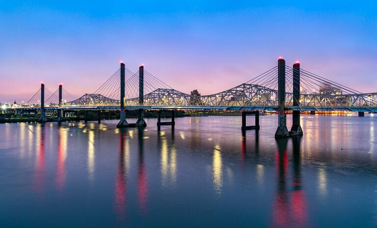 A photo of the Abraham Lincoln Bridge and the John F. Kennedy Memorial Bridge across the Ohio River between Louisville, Kentucky and Jeffersonville, Indiana.
